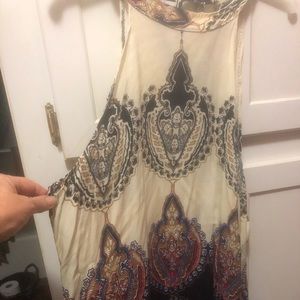 Halter like tunic. Very light and cool with tie